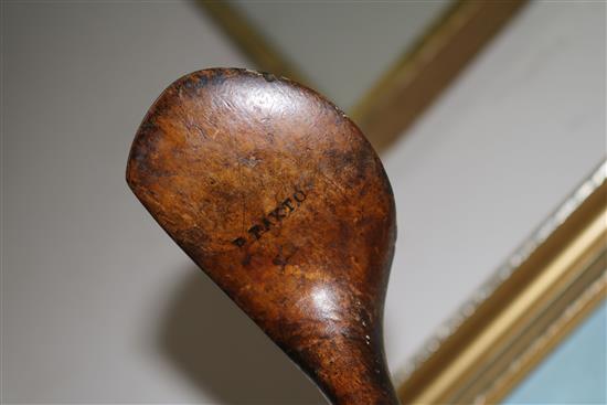 Two wooden drivers by Armstrong & Co and Paxton, a gun metal putto signed Jacques, 7 other and a golf ball